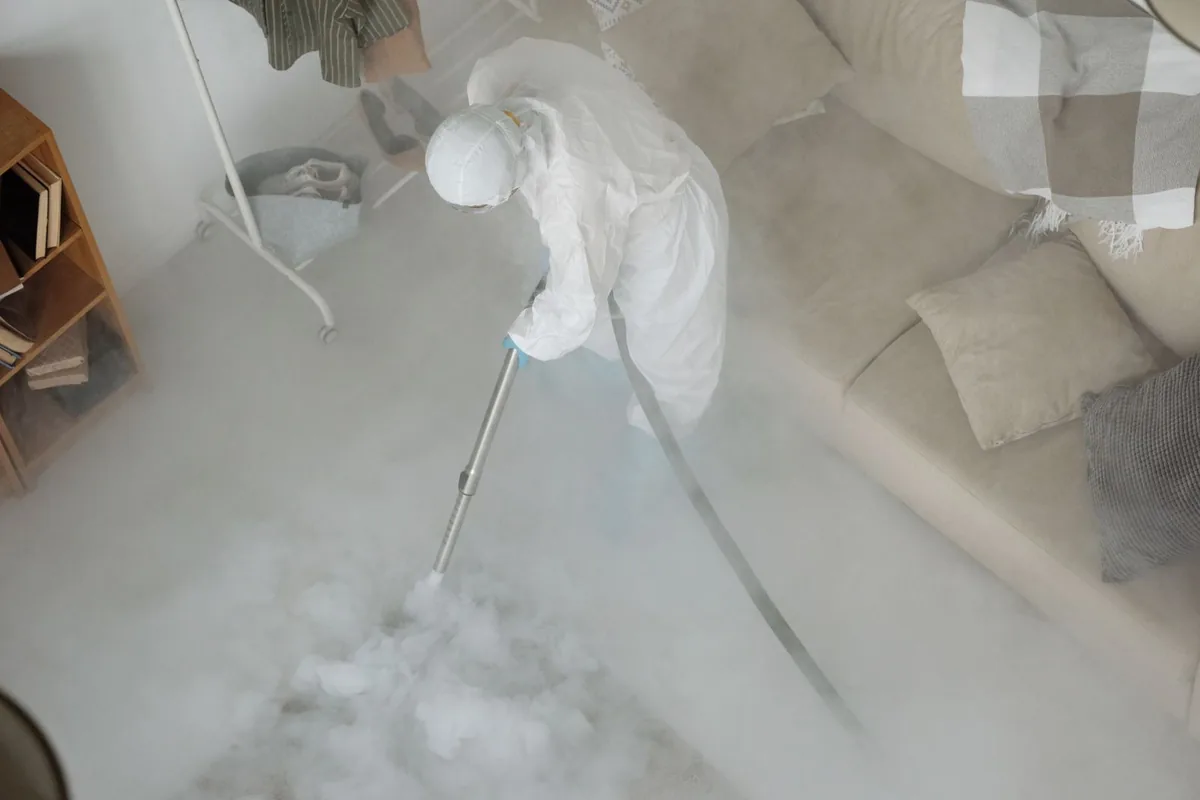 Biohazard cleanup technician in protective equipment, Crescent City, CA